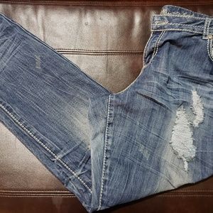 Tattered wrinkle style jeans